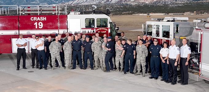 The fire and rescue team in front of a couple of tankers.